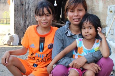 Duong Thi Canh and her daughters pose for a photo in Hai Phong village at their home near Vung Ang 1 coal-fired power plant. Photo: Le Quynh